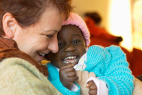Shelly Jones and her adopted Ugandan daughter, Shakira - photo by Martin Dee