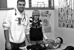 UBC Pediatric resident Dr. Jacob Rozmus examines a child in a First Nation’s Health Clinic - photo courtesy of Brighter Smiles