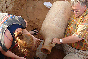 Archeologist Roger Wilson pulls out the day amphora from its 1,500 year hiding place - photo courtesy of Roger Wilson