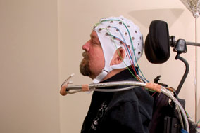 Tetraplegic Don Danbrook demostrates a prototype BCI recording cap - photo courtesy of ICORD