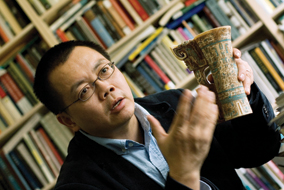 Zhichun Jing holds a replica of a 1,200 BC ivory cup from the Shang Dynasty of China’s Bronze Age - photo by Martin Dee