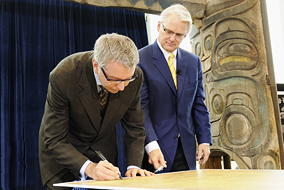 UBC President Stephen Toope and Premier Gordon Campbell rededicate the 100-year-old University Act - photo by Martin Dee